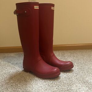 Tall red Hunter rain boots